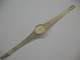 Armbånds ur i 
14 karat guld 
sweiss made 
saphir af 
Firmaet Tissot. 
Længde 16,5 cm 
og længde på ur 
...