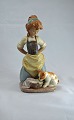 Figur i 
glaseret 
keramik af pige 
med hundehvalp
Design af 
LLadro
LLadro figur, 
keramikfigur, 
...