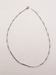 Sølvsmed Fl. 
Lund København 
sterling sølv 
halskæde længde 
45 cm. bredde 
0,2 cm.  Nr. 
278153