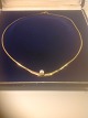 Hals collier 
med perle.
Guld 8 k 333
Kæde længde: 
43 cm.
perle Ø 5,4 
mm.
Vægt 4,3 ...