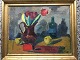 Thorvald 
Petersen 
(1899-1988):
Opstilling på 
bord med 
tulipaner i 
kande, flaske, 
frugter mv. ...