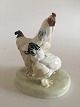 Meissen 
Figurine of Two 
Chickens. 22 cm 
H (8 21/32"). 
18 cm dia (7 
3/32"). The 
chicken in 
front ...