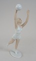 Schaubach 
porcelain 
figurine of 
ball-playing 
young woman, 
Germany. Glazed 
white porcelain 
and ...