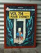 Tintin plakat 
af Herge med 
skriften "Les 
aventures de 
Tintin Vol 714 
Pour Sydney"
Billedet er 
...