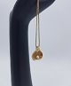 Vedhæng i 14 
karat guld med 
en lille perle. 

Måler ca. 1,7 
cm. i højden og 
ca. 1,6 cm. i 
...