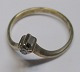 Gold ring, 8 
carat, red gold 
with 
brilliant-cut 
diamond. 20th 
century. 
Brillant: 0.01 
carat. ...