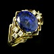18k Gold Ring 
with Sapphire 
and Brillant 
Cut diamonds. 
Large Oval 
4.55 ct 
Sapphire.
Six ...