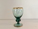 Holmegaard, 
Gisselfeldt, 
Blå/grønt 
hvidvinsglas 
med guldkant, 
12cm høj, 6,5cm 
i diameter, 
Design ...