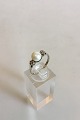 Ring in 14 K 
White Gold with 
Pearl and two 
small 
Brilliants. 
Ring Size 51 / 
US 6. Weighs 
2.17 g ...
