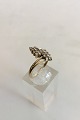 Gold ring in 
14K with 16 
small stones. 
Ring size 54 / 
US 7 1/4. 
Weighs 3.08 g / 
0.11 oz. 
Stamped ...