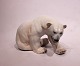 Kgl. 
porcelænsfigur, 
stor siddende 
isbjørn, nr.: 
433 af Knud 
Kyhn.
Mål: H:23 cm, 
B:31 cm og ...