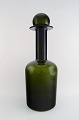 Holmegaard 
kæmpestor 
vase/flaske med 
låg i form af 
kugle, Otto 
Brauer. 
Flaskegrøn.
Måler : 51 ...