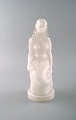 Havfrue i hvidt 
glas. 
1900-tallet.
I flot stand.
Måler: 24,5 x 
11,5 cm.
