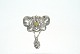 Elegant Broche 
i Jugendschetil 
med gul sten 
sølv
Stemplet 830S
brede 56,43 mm
højde 7 cm
pæn ...