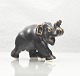 Royal 
Copenhagen. 
Elefant med 
løftet snabel, 
nr. 20220E 
elefanten er 
udført i 
stentøj, der er 
...