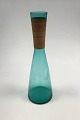 Kastrup 
Glasværk 
Opaline form 
Grøn Karaffel 
med 
bambusbevikling.
 Jacob E. Bang 
1957. Måler 40 
cm