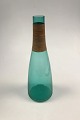 Kastrup 
Glasværk 
Opaline form 
Grøn Karaffel 
med 
bambusbevikling.
 Jacob E. Bang 
1957. Måler 36 
cm