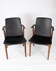 Dette par 
armstole i 
klassisk sort 
læder og teak, 
designet af 
Hans Olsen fra 
1960'erne, ...