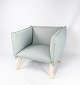 Dormi 
loungestol, 
polstret i gråt 
stof og med ben 
af bøg, er et 
indbydende 
møbelstykke, 
der ...