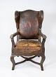 Antik 
øreklapstol med 
originalt 
mørkebrunt 
læder fra 1790.
H - 111 cm, B 
- 60 cm, D - 63 
cm og ...