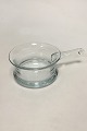 Holmegaard 
Glasskål med 
håndtag. Måler 
26 cm