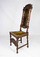 Antik stol af 
eg med 
udskæringer i 
renæssance 
stil, i flot 
stand fra 
1880erne.  
H - 136 cm, B 
...