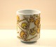 Royal 
Copenhagen 
fajance.  
Baca-vase, nr. 
156/3541
Vasen er 
dekoreret med 
gule og orange 
...