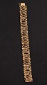 14 karat guld 
armlænke L. 
18,5 cm. B. 
1,75 cm. 
stemplet 585 BH 
for juveler 
Bernhard Hertz 
Kbh. ...