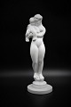 Kähler , hvid 
glaseret 
keramik figur 
af kvinde med 
barn.
H:31,5cm. Er i 
hel og i fin 
stand.