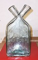 Gammelt glas: 
Dobbelt 
lommeflaske, 
der kan stå. 
Oprindelse 
ukendt. 
Formodes 
fremstillet på 
...