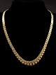 14 karat guld 
murstens 
halskæde L.41,5 
cm. B.5,5-0,95 
cm. fra 
guldsmed Johs 
Kahn København. 
emne ...