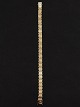 14 karat guld 
murstens 
armlænke 19,5 
cm. B. 0,7 cm. 
16,7 gr. 
guldsmed B N 
Henriksen 
København ...