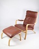 Lænestol og 
skammel, model 
MH 101 
formgivet af 
Mogens Hansen 
fra omkring 
1960'erne. 
Stolen har ...
