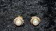 Elegante 
Øreringe i 8 
karat Guld med 
zikoner og hvis 
perle
Stemplet 333 
Måler 11,61 mm 
...
