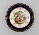 Antik Meissen 
tallerken i 
håndmalet 
porcelæn. 
Romantisk 
scene, blå kant 
med 
gulddekoration. 
Sent ...