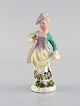 Meissen, 
Tyskland. Antik 
håndmalet 
porcelænsfigur. 
Dame med 
blomster. Sent 
1800-tallet.
Måler: ...