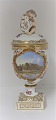 Royal 
Copenhagen. 
Porcelæns 
ægvase med 
putti. Motiv : 
Botanisk Have. 
Højde 27 cm. 
Produceret ...