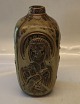 3544 Kgl. Vase 
med figurativ 
relief 22.5 cm 
Jais Nielsen 
Sung glasur 
Royal 
Copenhagen 
stentøj I ...