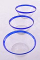 Tykmælksskåle 
af klar glas 
med blå kant, 
ca. højde 6 cm. 
diameter 14,8 
cm. Dansk 
glasværk fra 
...