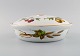 Royal 
Worcester, 
England. 
Evesham 
lågterrin i 
porcelæn 
dekoreret med 
frugter og 
guldkant. ...
