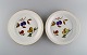 Royal 
Worcester, 
England. Et par 
Evesham fade / 
skåle i 
porcelæn 
dekoreret med 
frugter og ...