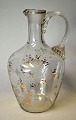 Antik klar glas 
kande med 
ætsede blomster 
og forgyldning, 
19. årh. Med 
sneglehank  H.: 
14,5 ...