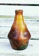 Miniature vase 
i keramik fra 
Peter Ipsens 
Enke. Formgivet 
og glaseret i 
skønvirkestil. 
Fremstår ...
