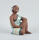 Mari Simmulson 
figur.
Sjælden 
keramikfigur af 
halvnøgen 
Tahiti-kvinde. 
Upsala-Ekeby.
ca. ...