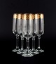 Italiensk 
design, seks 
champagneglas i 
klart kunstglas 
med guldkant.
Ca. 
1960/70'erne.
I ...