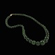 Jade halskæde 
med forgyldt 
lås.
L. 46 cm.
Jadeperle 
diam. 0,6 - 1,4 
cm. 
Vægt 40,6 g.
Brugt ...