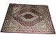 Et ægte persisk 
tæppe 
fremstillet i 
hånden mønstret 
og indfarvet 
med rødlige 
farver i ...