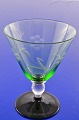 Kastrup 
glasværk fra 
1938. Lis 
blomster slebet 
glas på sort 
fod 
Lis grønne 
hvidvinsglas på 
...