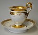 Tysk empire 
porcelains 
kaffekop med 
underkop, 19. 
årh. Hvidt 
porcelæn med 
forgyldninger. 
...