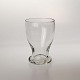 Tøndeformet 
glas med tyk 
fod.
Producent 
Formentligt 
Holmegaard
Højde 9,5 cm 
Diameter top 
...